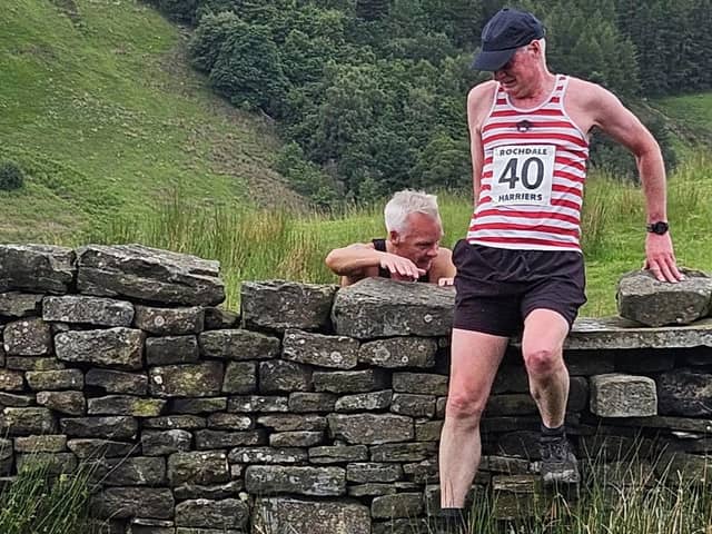 Tony Steward negotiates a wall at the Knowle Hill Fell Race. Pic: Rochdale Harriers