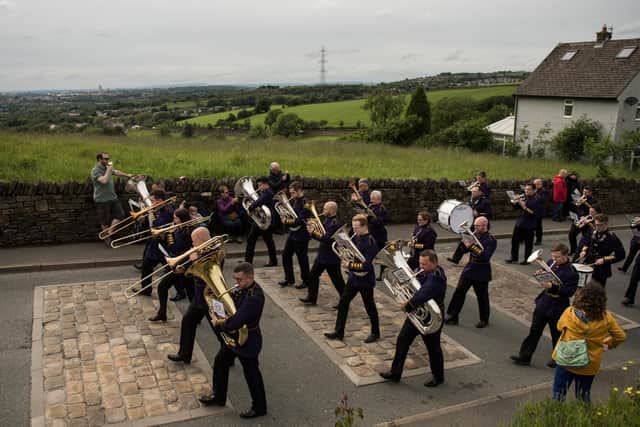 Members of Brighouse and Rastrick Band play in the Whit Friday brass band competition back in 2019. (Photo by OLI SCARFF/AFP via Getty Images)