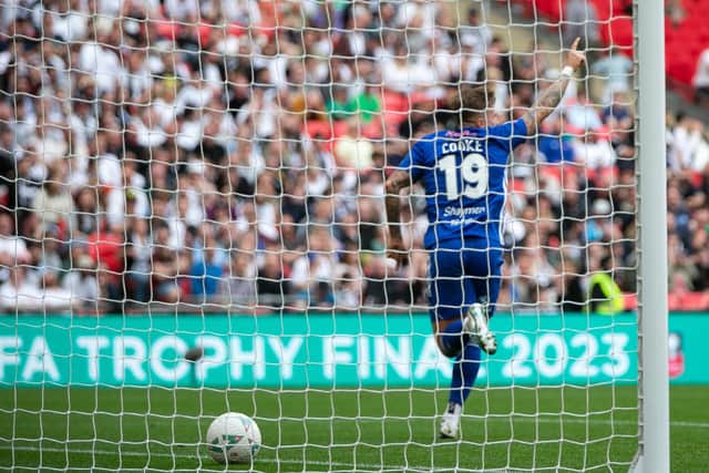Jamie Cooke wheels away in celebration after scoring the only goal of the FA Trophy final at Wembley. He later described it as "the most amazing moment" of his life.