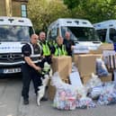 Officers from Halifax Neighbourhood Policing Team with some of the seized counterfeit goods
