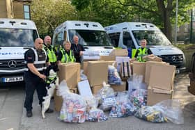 Officers from Halifax Neighbourhood Policing Team with some of the seized counterfeit goods