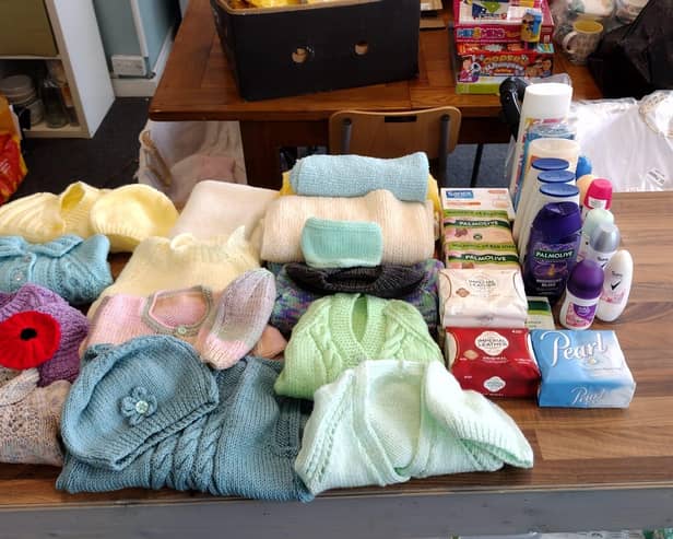 Knitted items for the Baby Bank in Heckmondwike which supplies disadvantaged families with pre-loved baby equipment such as cots, prams, clothing and baby food.