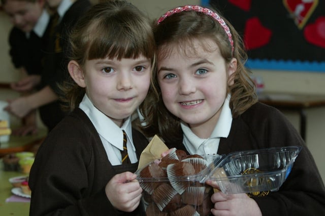 Georgina Lewthwaite, six, and Megan Brimelow, six, at the Valentine's Day bun sale at St Joseph's School, Brighouse, in 2004