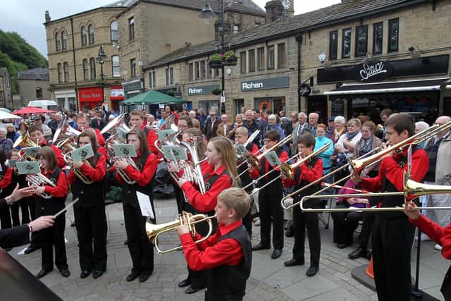 Elland Silver Youth Band, seen here performing at the Hebden Bridge brass band marching contest in St George's Square, will be playing seasonal music at Halifax Minster on Christmas Eve.