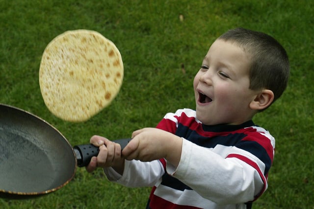 Jacob Mills, four, tosses a pancake at Apple Tree Day Nursery, Queens Road, Halifax in 2007