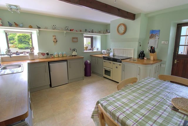 A large country dining kitchen with range cooker.