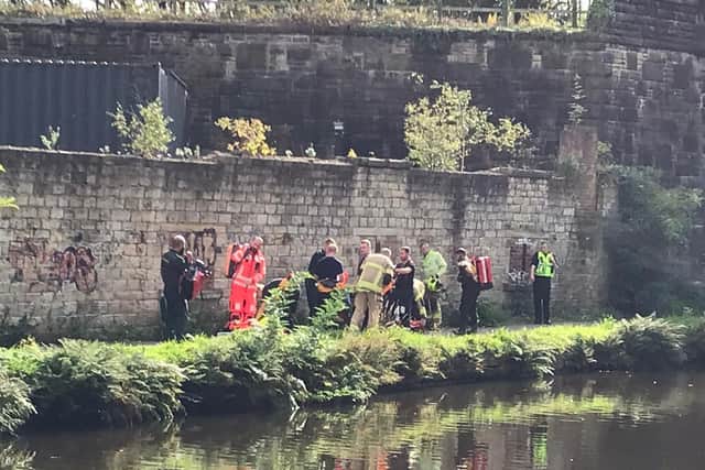 Police, firefighters and paramedics on the canal towpath