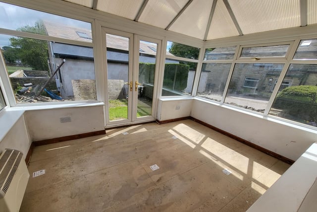 This conservatory could be replaced by a gabled extension, within plans that have been approved.