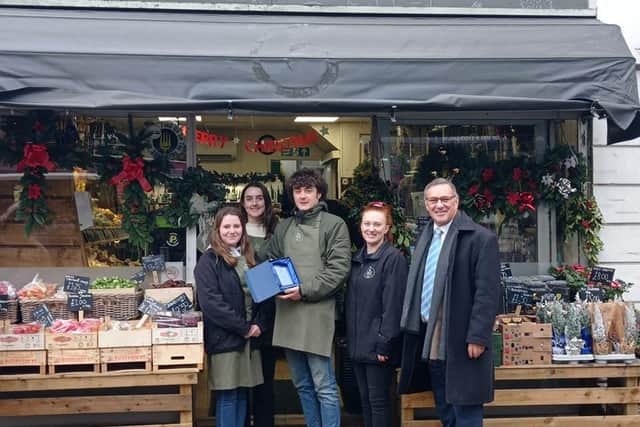 Craig Whittaker presents the team at The Veg Shop in Brighouse with their award