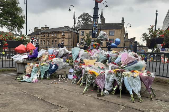 Flowers outside The Victoria Theatre in Halifax left for the two young men