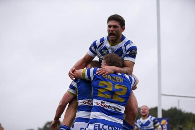 Halifax Panthers players celebrate after winning their 1895 Cup semi-final against London Broncos