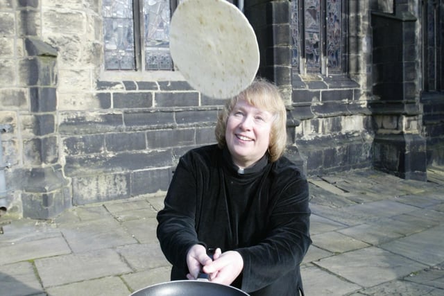 The vicar of Halifax, Rev Wendy Wilby, is pictured tossing pancakes at Halifax Parish Church back in 2004.