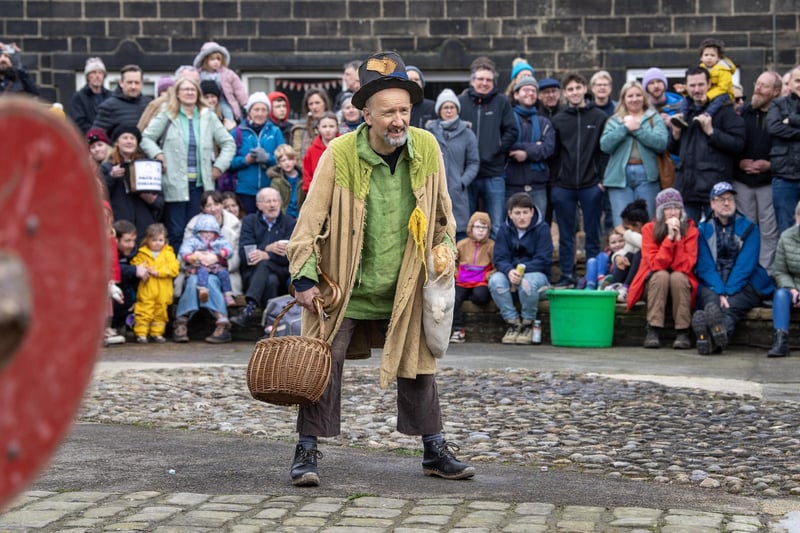 The cast of the Heptonstall Pace Egg perform in Weavers Square