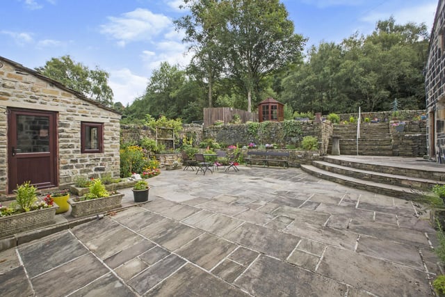 There is plenty of patio space for sitting out or entertaining, a lawned garden and summerhouse.