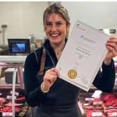 Butchery apprentice Helena Akroyd at Craggies Farm Shop with her apprenticeship completion certificate