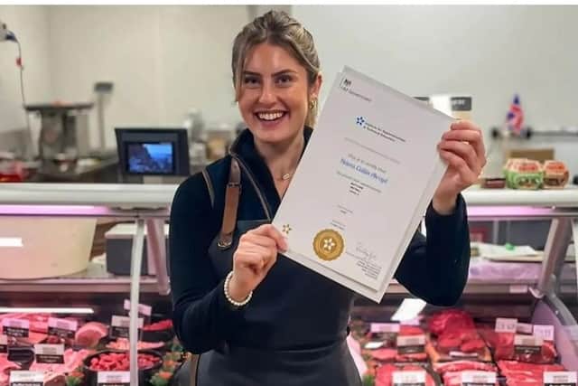 Butchery apprentice Helena Akroyd at Craggies Farm Shop with her apprenticeship completion certificate