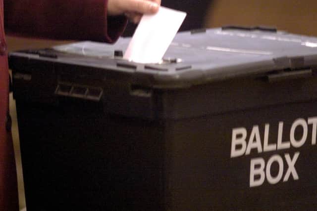 Polling day for this year's Calderdale Council's elections takes place on Thursday May 4. A generic photo of a vote being placed into a ballot box.