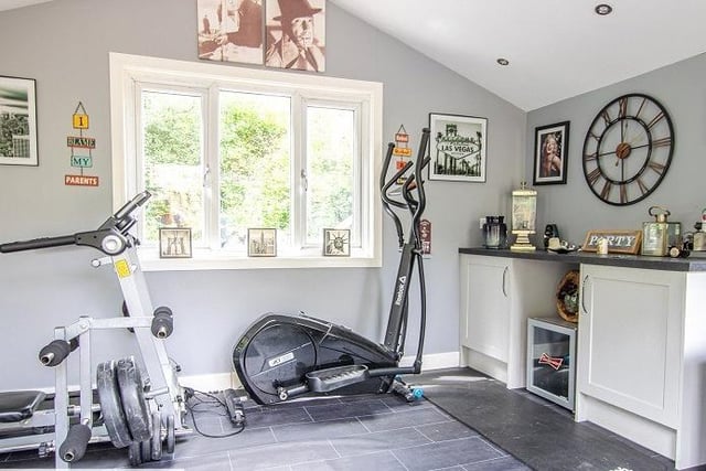 This room of flexible use is currently being used as a home gym.