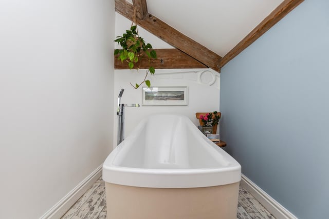 A deep free-standing bath in which to soak your troubles away...
