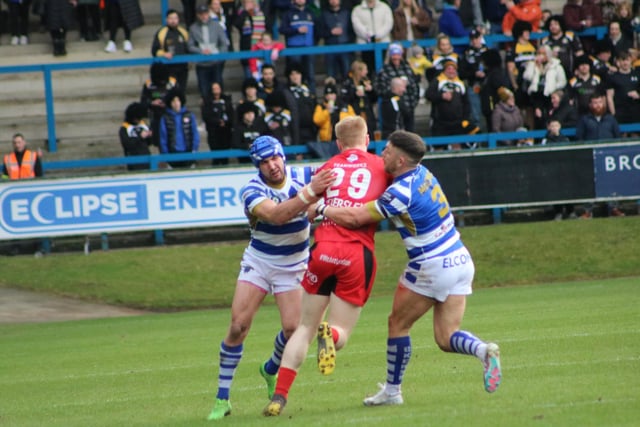 4. Louis Jouffret and Zach McComb combine to tackle an opposition player