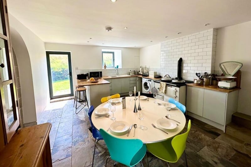 The bright dining kitchen, with a warming Aga.