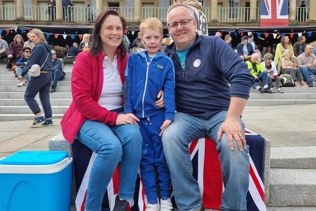 The Hough family, from Lancashire, perched on a Union Jack beach towel near the West Gate entrance. From left, Clare, Logan and Mike.