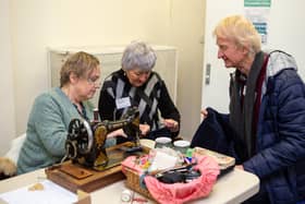 The first Skircoat Repair Cafe inspired at All Saints Parish Hall. Pictured is Coun Ann Kingstone and Ruth Ingham and customer Paul Gunningham