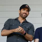 WREXHAM, WALES - MAY 28: Ryan Reynolds, Owner of Wrexham and Rob McElhenney, Actor and Co-Owner of Wrexham react prior to the Vanarama National League Play-Off Semi Final match between Wrexham and Grimsby Town at Racecourse Ground on May 28, 2022 in Wrexham, Wales. (Photo by Lewis Storey/Getty Images)
