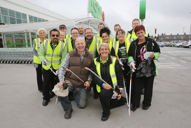 Asda, McDonalds, Calderdale Council staff and Keith Hutson, vice chair of governors at Halifax High, front, doing a litter-pick.