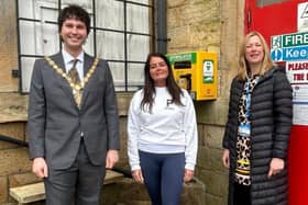 Hollins Mill. Coun Tyler Hanley, Emma Louie and  Emma Kovaleski, Charity Manager at Calderdale, and Huddersfield NHS Charity