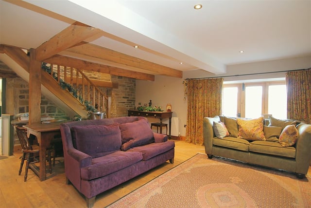 This room enjoys far reaching views, and has doors out to the terrace.