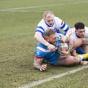 Wakefield Trinity's Josh Griffin is tackled by Oli Lewis of Siddal in Saturday's Challenge Cup match