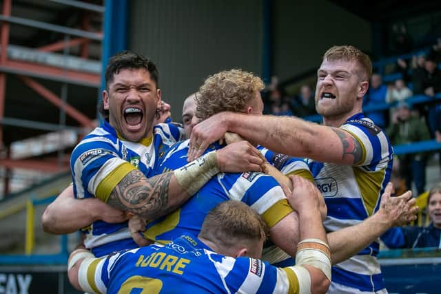 Fax players celebrate Jake Maizen's late try which ensured a 26-18 opening day victory over Sheffield Eagles.