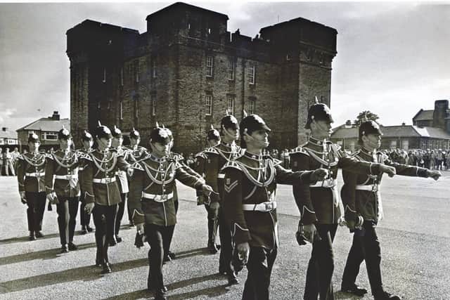 End of an era: Soldiers from Halifax's historic Duke Of Wellington's Regiment 'beat the retreat' at Wellesley Park Barracks, their former home, pictured in 1989.