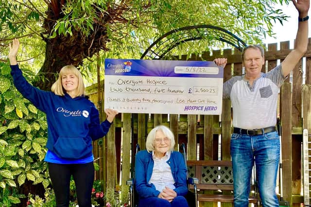 Eve Brady (centre) pictured with the cheque for Overgate