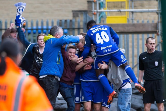 Halifax players and supporters celebrate a goal