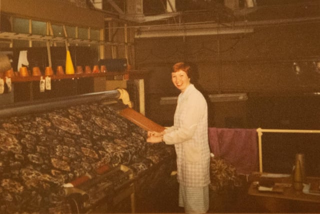 Photo of Rita Dews at work at Crossley Carpets, Dean Clough
