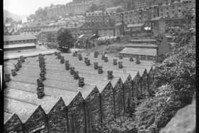 Hebden Works, Valley Road, Hebden Bridge, 1966-1974. A view looking north across Hebden Bridge with the north lit roofs of Hebden Works in the foreground and the terraces on Lee Mill Road in the distance.