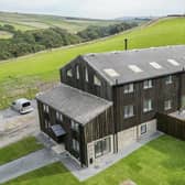 A row of three barn conversions with approx 10 acres of land is for sale with Farrow & Farrow for £1,750,000. Lower Gorpley, Gorpley Lane, Todmorden is a barn conversion comprising three separate units which together, amount to 11 bedroom, 9 bathroom accommodation spread over around 5,000sqft in total.