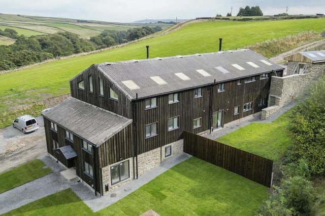 A row of three barn conversions with approx 10 acres of land is for sale with Farrow & Farrow for £1,750,000. Lower Gorpley, Gorpley Lane, Todmorden is a barn conversion comprising three separate units which together, amount to 11 bedroom, 9 bathroom accommodation spread over around 5,000sqft in total.