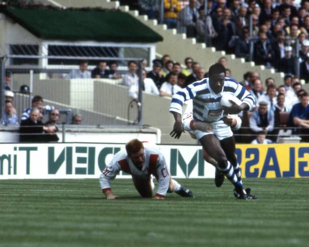 Wilf George, a fellow winger like Walmsley, breaks a tackle during the 1987 Wembley Challenge cup final which Halifax won against St Helens 19-18. George scored the first try of the pulsating match.