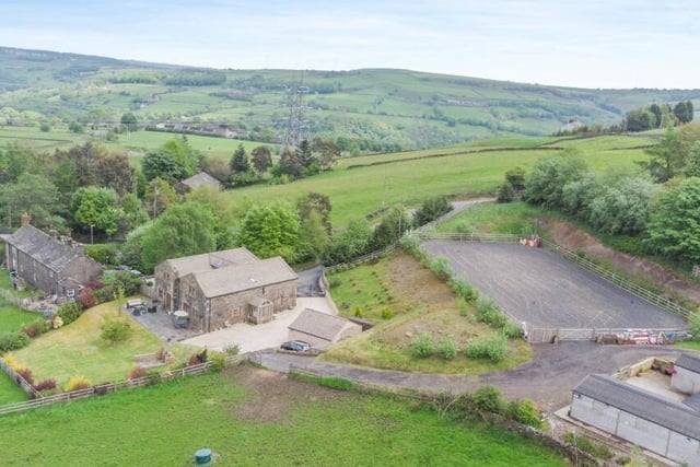 The property includes four stables, arena and paddock grazing
