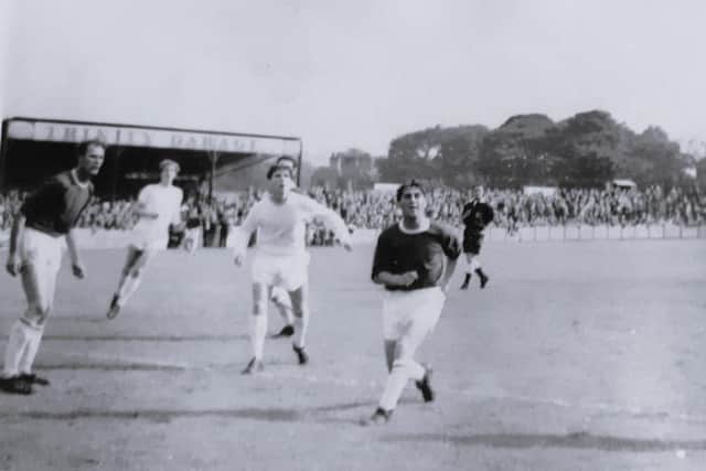 Alex on left in action photo from a game with Bradford PA, 12 September 1964.