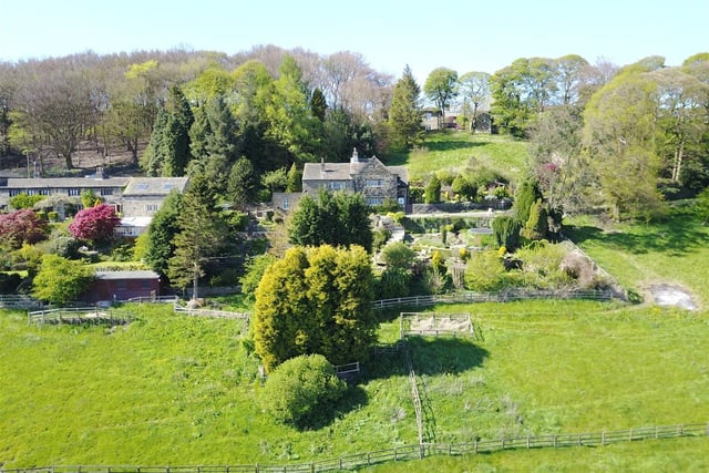 An overview of the detached property and its extensive grounds.