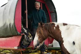 Joe Cannon, from Manchester, pictured at Appleby horse fair in 2021 with his horses and wagon. The fair at Appleby-in-Westmorland is an annual gathering for Gypsy, Romany and travelling communities. Hundreds of travellers attend the event who traditionally come to buy and sell horses and it offers an opportunity for the traveller community to come together to celebrate their heritage and culture. Photo by Ian Forsyth/Getty Images