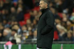 Southampton's caretaker manager Kelvin Davis watches his players from the touchline during the English Premier League football match between Tottenham Hotspur and Southampton at Wembley Stadium in London, on December 5, 2018. (Photo by Ian KINGTON / AFP) / RESTRICTED TO EDITORIAL USE. No use with unauthorized audio, video, data, fixture lists, club/league logos or 'live' services. Online in-match use limited to 120 images. An additional 40 images may be used in extra time. No video emulation. Social media in-match use limited to 120 images. An additional 40 images may be used in extra time. No use in betting publications, games or single club/league/player publications. /         (Photo credit should read IAN KINGTON/AFP via Getty Images)