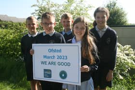 Children from Holywell Green Primary School celebrate their Ofsted report