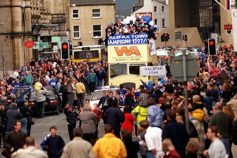 Champions Halifax Town come home with the Vauxhall Conference League Trophy along Commercial Street on their way to a reception at the Town Hall. .