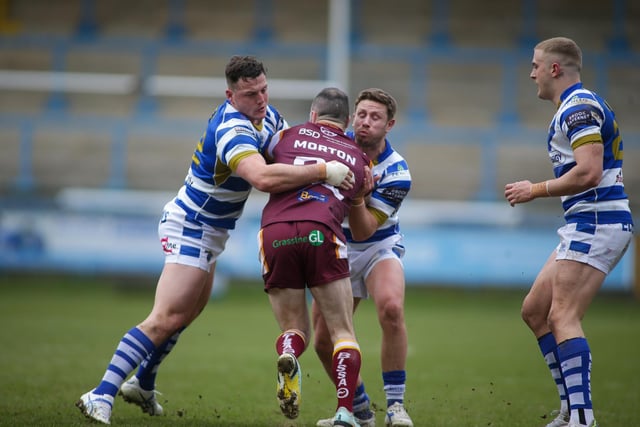 5. Batley's Dale Morton is tackled by two Halifax players