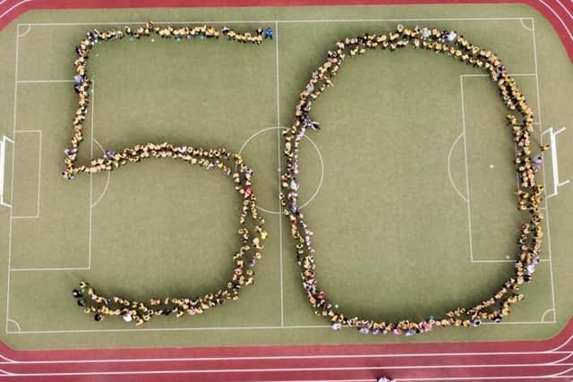 Pupils at Old Earth Primary School in Elland gathered in this 50 shape to celebrate their school's special anniversary (Photo by Simon Edlestein)